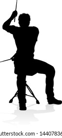 A drummer musician drumming drums in detailed silhouette