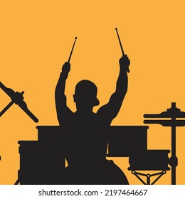 A drummer musician drumming drums in detailed silhouette