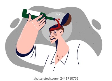 Drunk man pours wine into head, demonstrating antisocial lifestyle and dependence on alcohol. Drunk guy with bottle of bordeaux, suffering from hangover after friday alcoholic party