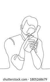 drunk man sits lovingly clutching a bottle of alcohol. one continuous line drawing concept alcoholic / drink addict cannot physically break away from alcohol