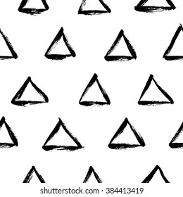 Dry brush texture. Hand drawn black ink triangles isolated on white background. Seamless pattern. 