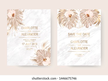 Dry gold tropical palm leaves and orchid flowers frames for wedding design on marble background.