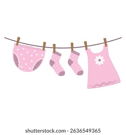 Drying wet children's clothes hung on a clothesline