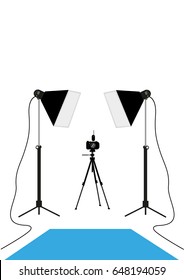 A DSLR camera between two studio lights. Editable Clip Art.