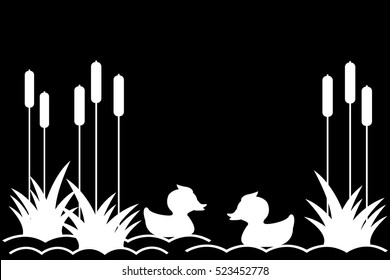 .Ducklings on the lake among the reeds.