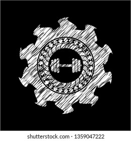 dumbbell icon drawn on a blackboard