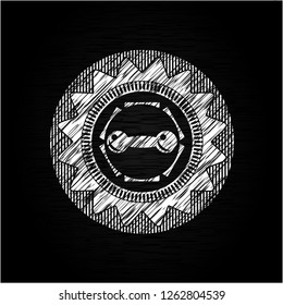 dumbbell icon drawn on a chalkboard