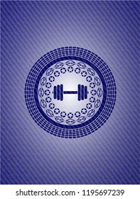 dumbbell icon inside badge with denim background