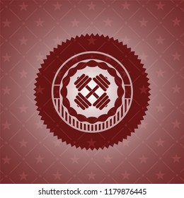 dumbbell icon inside badge with red background