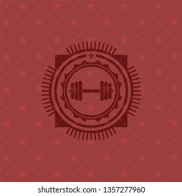 dumbbell icon inside badge with red background
