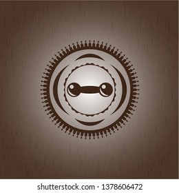 dumbbell icon inside badge with wooden background