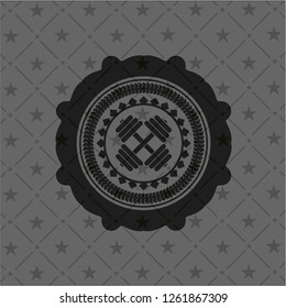 dumbbell icon inside black emblem