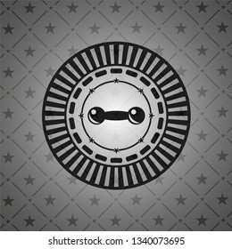 dumbbell icon inside black emblem
