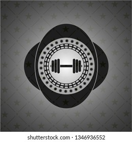 dumbbell icon inside black emblem