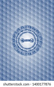 dumbbell icon inside blue emblem or badge with geometric pattern background.