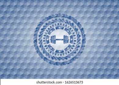dumbbell icon inside blue emblem or badge with abstract geometric polygonal pattern background.