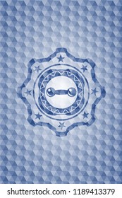 dumbbell icon inside blue hexagon emblem.