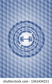 dumbbell icon inside blue hexagon emblem.