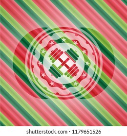 dumbbell icon inside christmas style badge..