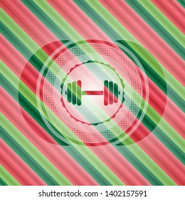 dumbbell icon inside christmas style emblem.