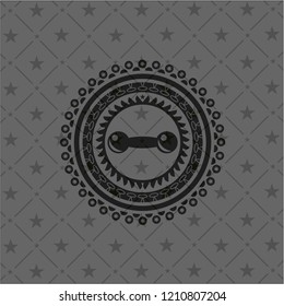 dumbbell icon inside dark badge