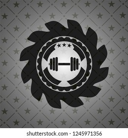 dumbbell icon inside dark badge