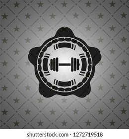 dumbbell icon inside dark badge
