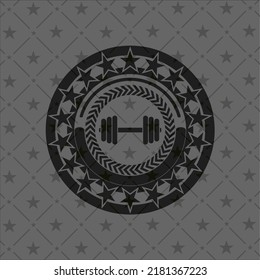icono de cascabel dentro de una placa o emblema oscuro. 