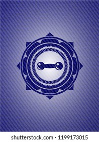 dumbbell icon inside denim background