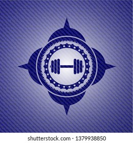 dumbbell icon inside denim background
