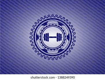 dumbbell icon inside denim background