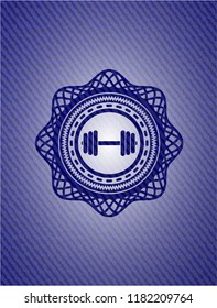 dumbbell icon inside emblem with denim texture