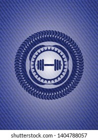 dumbbell icon inside emblem with denim high quality background