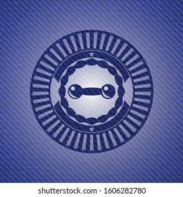 dumbbell icon inside emblem with denim texture