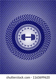 dumbbell icon inside emblem with jean background
