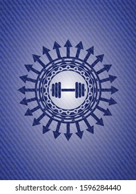 dumbbell icon inside emblem with jean background