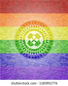 dumbbell icon inside emblem on mosaic background with the colors of the LGBT flag