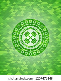 dumbbell icon inside green emblem with triangle mosaic background