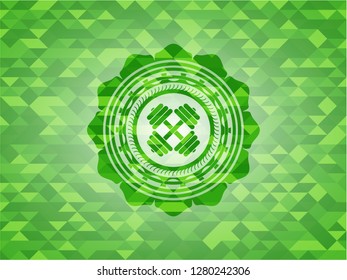 dumbbell icon inside green emblem with mosaic background