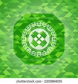 dumbbell icon inside green emblem with triangle mosaic background. 