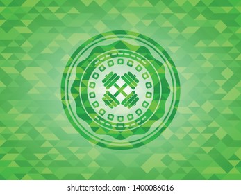 dumbbell icon inside green mosaic emblem