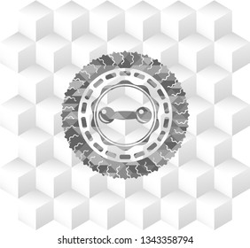 dumbbell icon inside grey badge with geometric cube white background