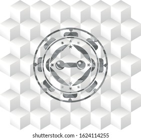 dumbbell icon inside grey badge with geometric cube white background