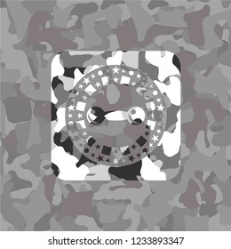 dumbbell icon inside grey camo emblem