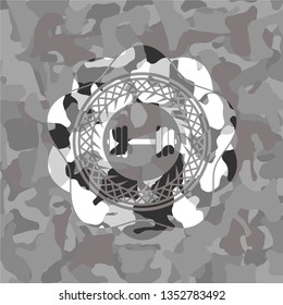 dumbbell icon inside grey camouflage texture