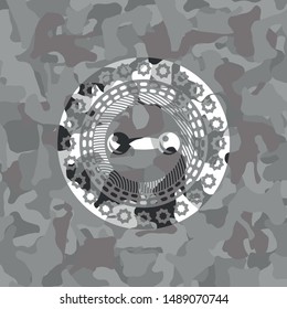 dumbbell icon inside grey camouflage emblem