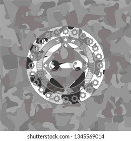 dumbbell icon inside grey camouflaged emblem