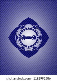 dumbbell icon inside jean background