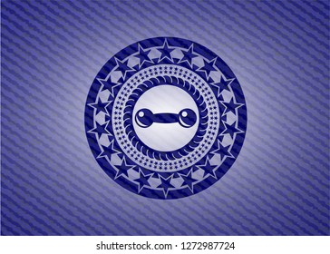 dumbbell icon inside jean background