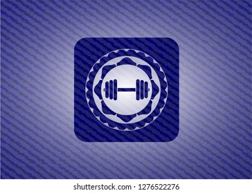 dumbbell icon inside jean background